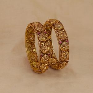 22Kt Gold Antique Nakshi Bangles With Lakshmi Devi And Peacock Motifs 125VG2555-125VG2556